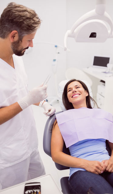 Dentist With Smiling Female Patient-1